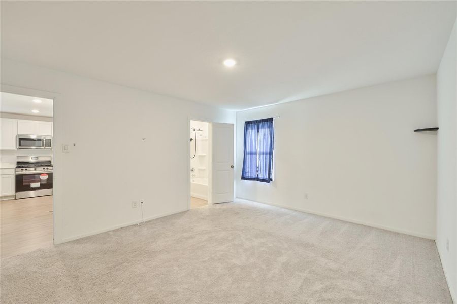 Spacious, unfurnished interior of a new home in Tavola: Cottage Collection, New Caney (Image 27).