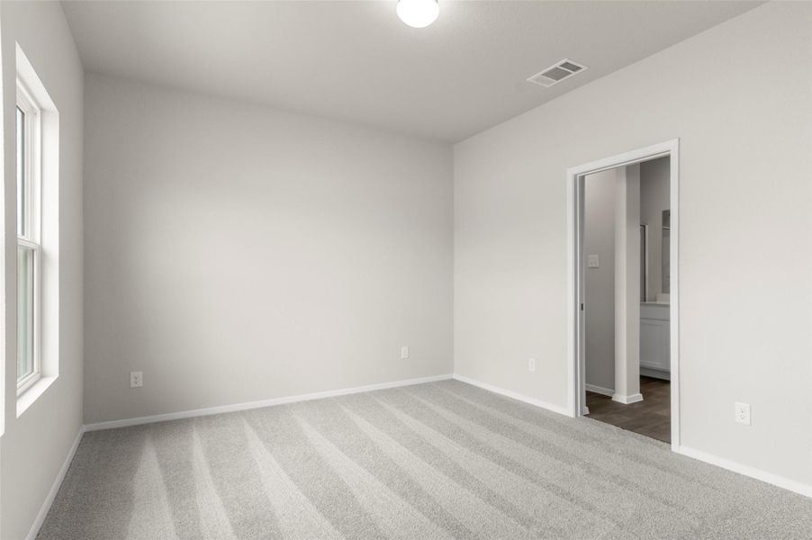 Spare room featuring carpet floors and baseboards Spare room featuring carpet floors and baseboards