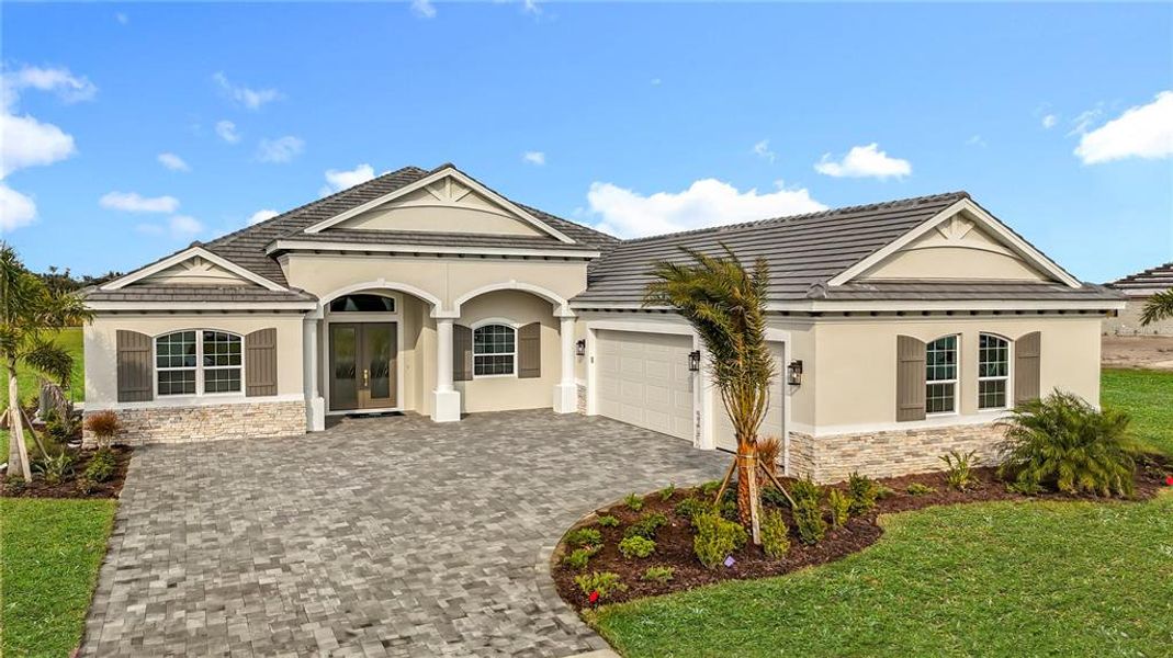 Front exterior of a new home in Hampton Lakes, Sarasota, FL, highlighting curb appeal (Image 1). Front exterior of a new home in Hampton Lakes, Sarasota, FL, highlighting curb appeal (Image 1).