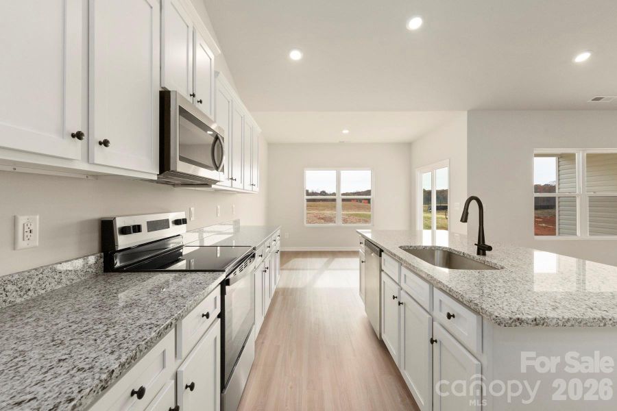 Furnished interior view inside a new home in Stagecoach Station, Gastonia (Image 4).