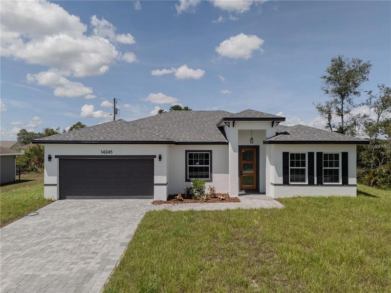 Front exterior of a new home in , Ocala, FL, highlighting curb appeal (Image 32). Front exterior of a new home in , Ocala, FL, highlighting curb appeal (Image 32).