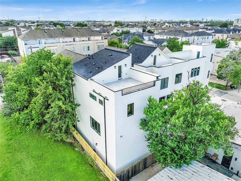 Captivating aerial view of a spacious rooftop terrace, perfect for outdoor relaxation and entertainment.