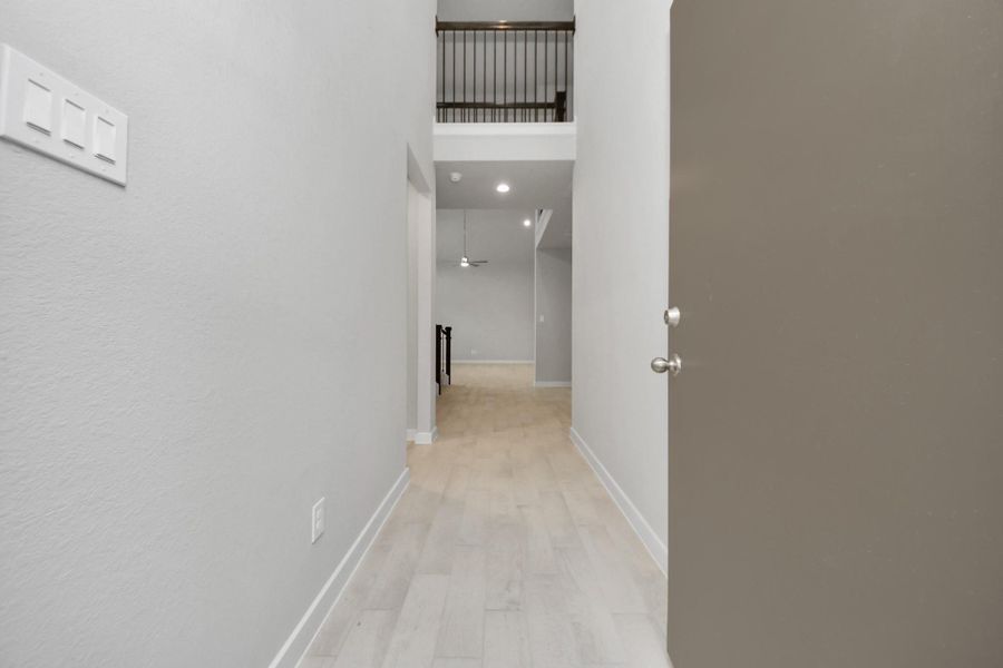 As you step into the threshold of this luxurious home, you'll soon be welcomed by anelegant glass door (to be installed). Inside, soaring ceilings amplify the spaciousness,while the refined wood-look tile flooring and oversized baseboards exudesophistication and charm. Sample photo of completed home with similar floor plan. Actual colors and selections may vary. As you step into the threshold of this luxurious home, you'll soon be welcomed by anelegant glass door (to be installed). Inside, soaring ceilings amplify the spaciousness,while the refined wood-look tile flooring and oversized baseboards exudesophistication and charm. Sample photo of completed home with similar floor plan. Actual colors and selections may vary.