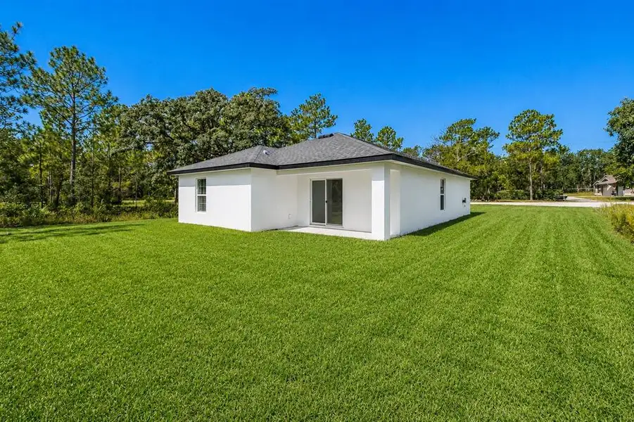 Exterior details and patio area of a home in , Brooksville (Image 30). Exterior details and patio area of a home in , Brooksville (Image 30).