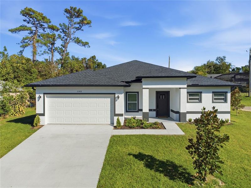 Front exterior of a new home in , Deltona, FL, highlighting curb appeal (Image 2). Front exterior of a new home in , Deltona, FL, highlighting curb appeal (Image 2).