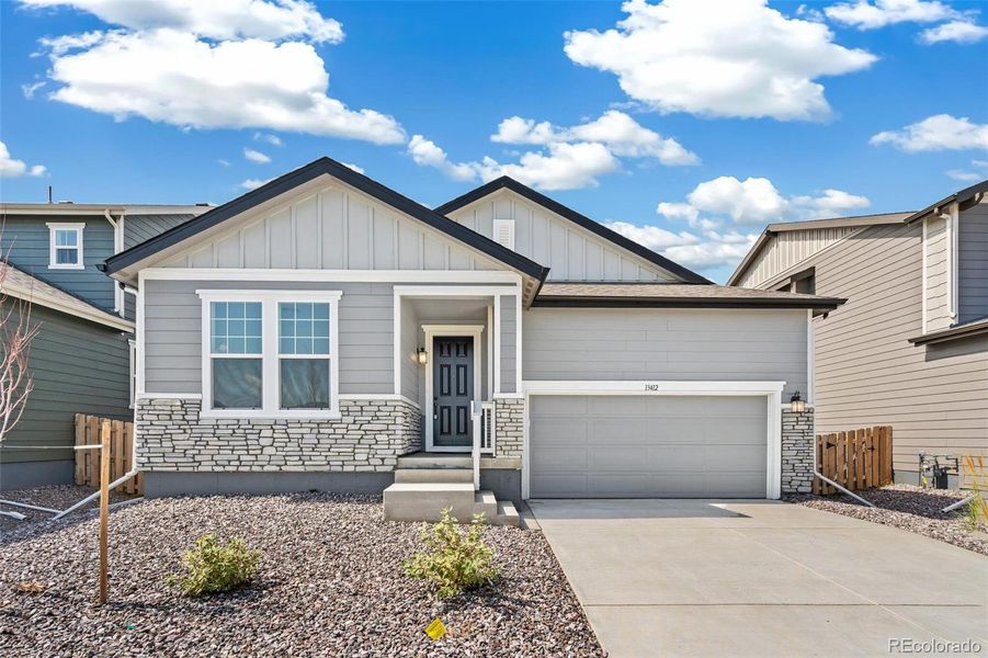 Front exterior of a new home in Turnberry, Commerce City, CO, highlighting curb appeal (Image 20).