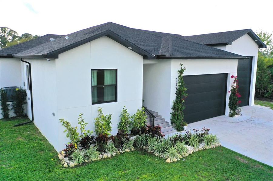 Front exterior of a new home in , Port Charlotte, FL, highlighting curb appeal (Image 25).