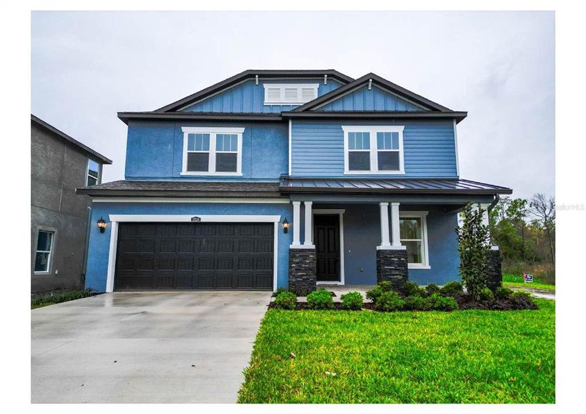 Front exterior of a new home in , Tampa, FL, highlighting curb appeal (Image 1). Front exterior of a new home in , Tampa, FL, highlighting curb appeal (Image 1).