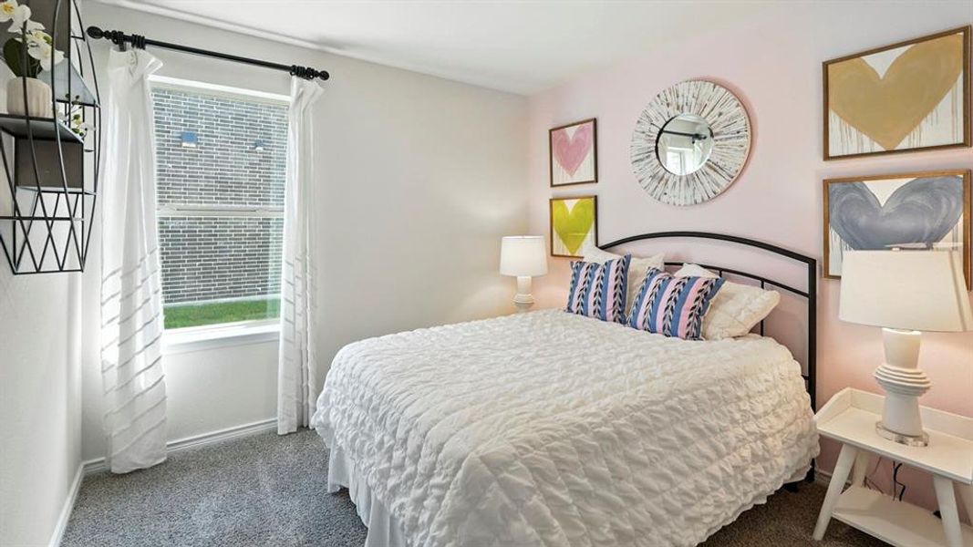 Bedroom with carpet floors and baseboards