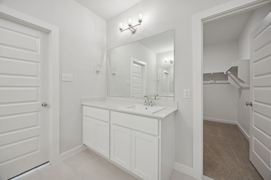 Primary Bathroom in the Masters home plan by Trophy Signature Homes – REPRESENTATIVE PHOTO