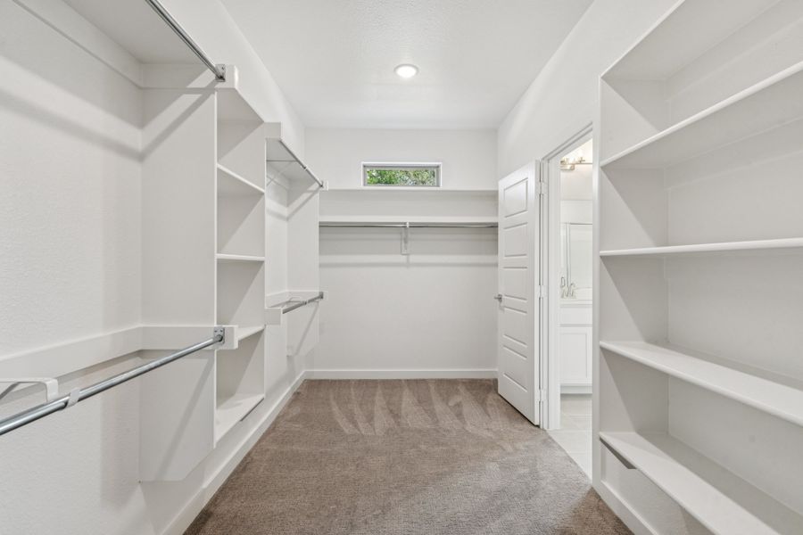 Primary Closet in the Mercury home plan by Trophy Signature Homes – REPRESENTATIVE PHOTO Primary Closet in the Mercury home plan by Trophy Signature Homes – REPRESENTATIVE PHOTO