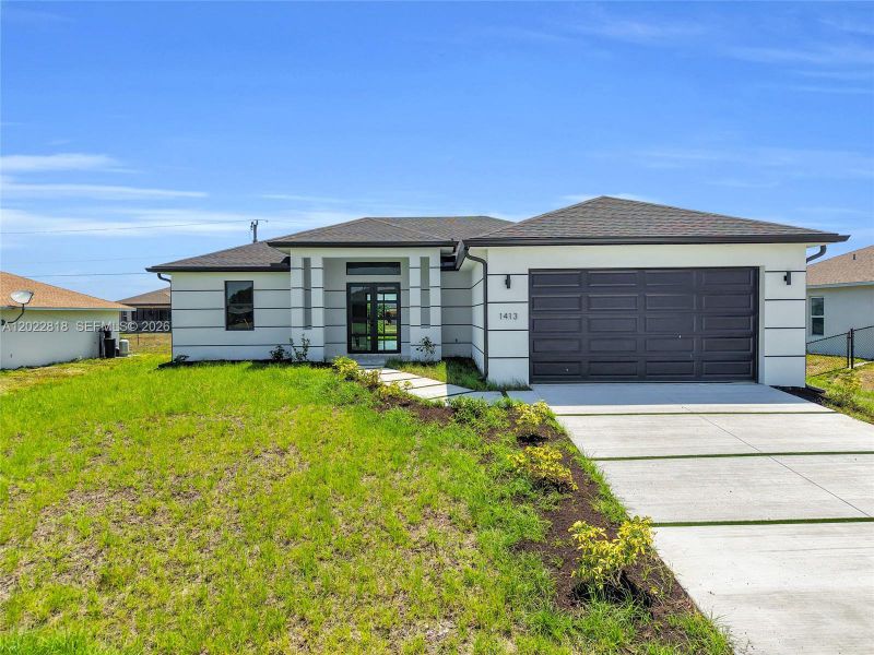 Front exterior of a new home in , Cape Coral, FL, highlighting curb appeal (Image 1). Front exterior of a new home in , Cape Coral, FL, highlighting curb appeal (Image 1).