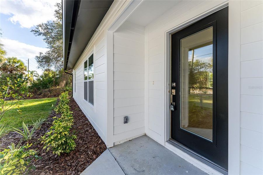 Exterior details and patio area of a home in , North Port (Image 23).