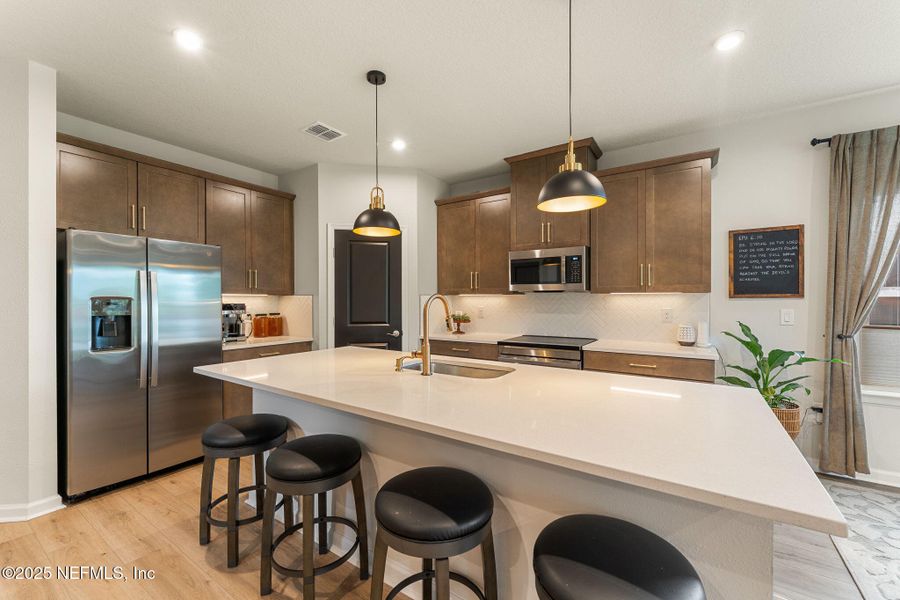 Furnished interior view inside a new home in Seminole Palms Single-Family Homes, Palm Coast (Image 46).