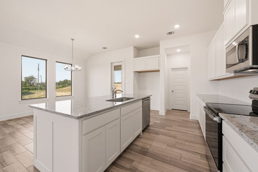 Furnished interior view inside a new home in Saddleback Estates, Boyd (Image 8).