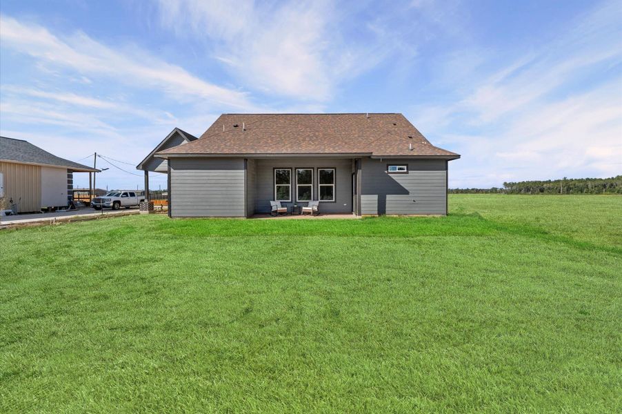 Expansive yard with no rear neighbor—blank canvas for a workshop, garden, or future outdoor kitchen. Expansive yard with no rear neighbor—blank canvas for a workshop, garden, or future outdoor kitchen.