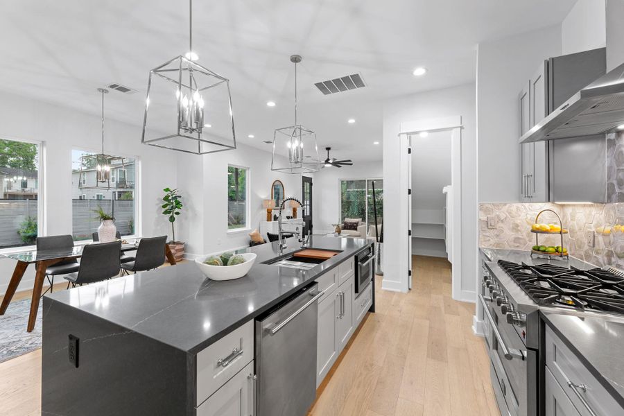 Kitchen with gas cooking, dark countertops, high end appliances - a true chef's dream! Kitchen with gas cooking, dark countertops, high end appliances - a true chef's dream!