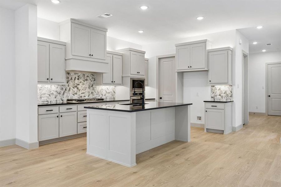 No shortage of style or space in this chef's dream kitchen!