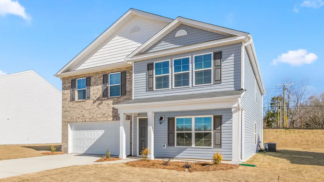 Front exterior of a new home in Aspen Place, Thomasville, NC, highlighting curb appeal (Image 2).