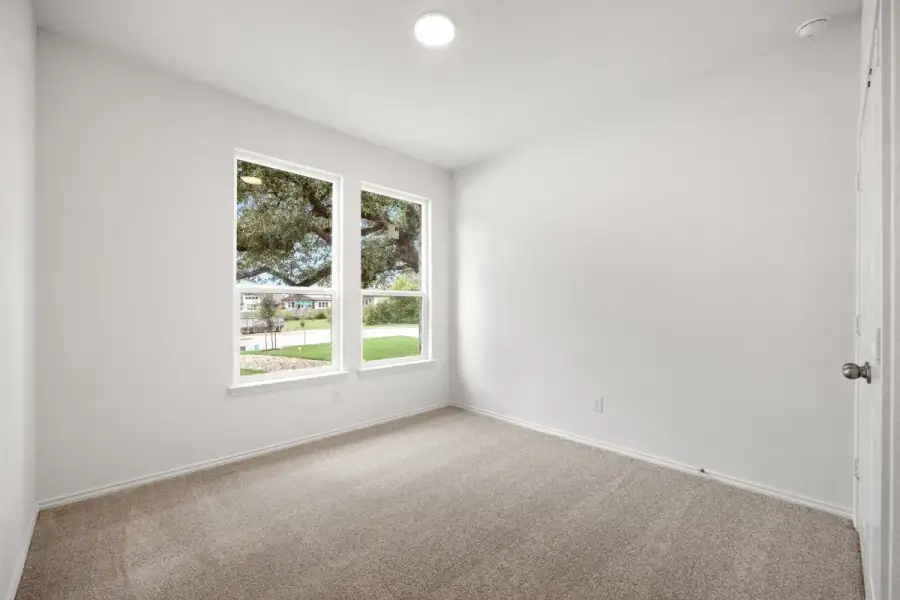 Spacious, unfurnished interior of a new home in River Bluff, Leander (Image 28).