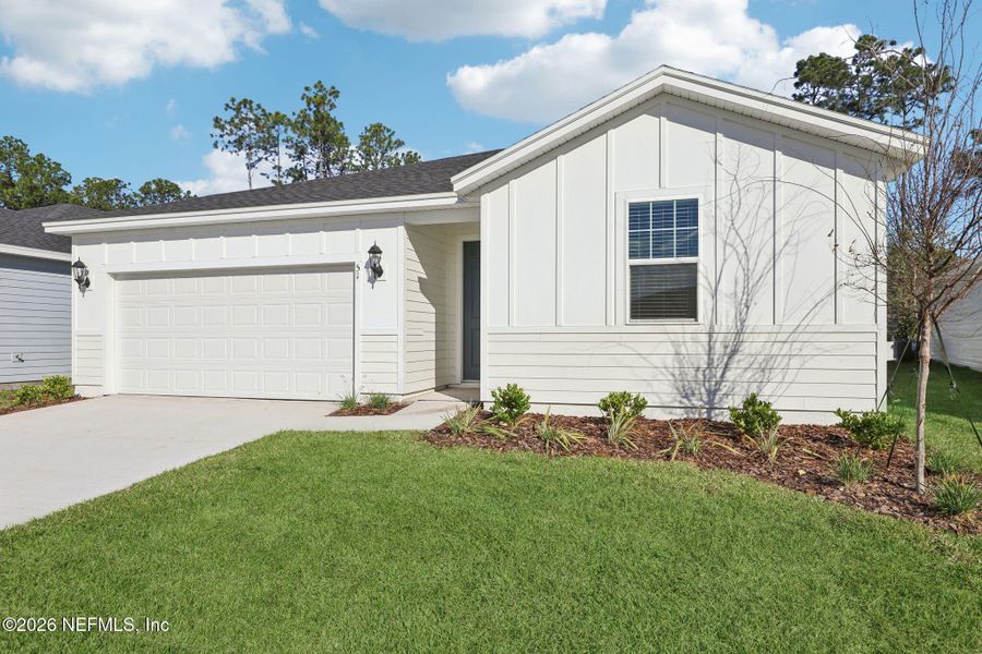 Front exterior of a new home in , Palm Coast, FL, highlighting curb appeal (Image 20).