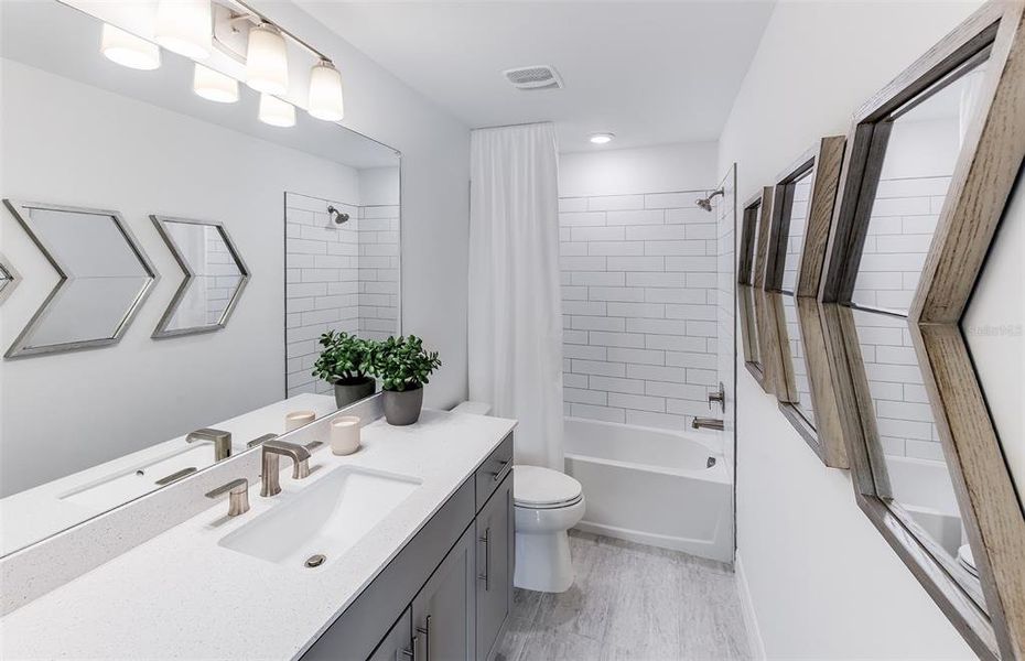 Furnished interior view inside a new home in The Strand at Cedar Grove, North Port (Image 17). Furnished interior view inside a new home in The Strand at Cedar Grove, North Port (Image 17).