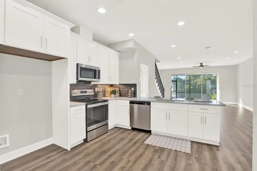 Furnished interior view inside a new home in The Towns At Long Bayou, Seminole (Image 5).