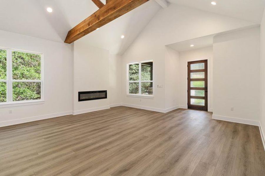Living room featuring an Electric Fireplace  and recessed lighting
