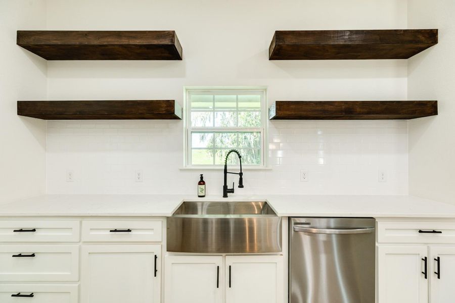 Stainless steel appliances and farmhouse sink