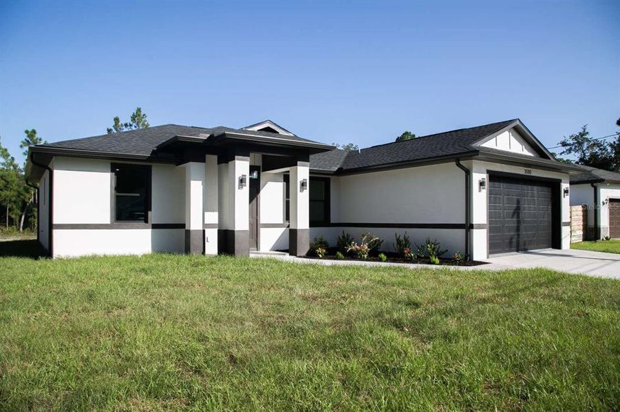 Front exterior of a new home in , North Port, FL, highlighting curb appeal (Image 28).