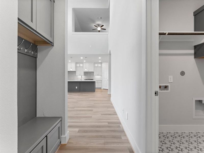 Built-in Bench with Hooks and Storage Cabinets As You Enter from Garage