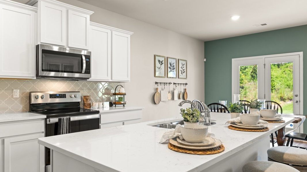 Representative furnished interior of a home built from the Elle by D.R. Horton in The Preserve at Agricultural Village, Perry (Image 12).