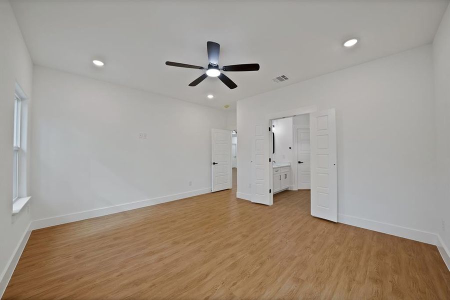 Unfurnished bedroom with light wood-style flooring, recessed lighting, and ceiling fan