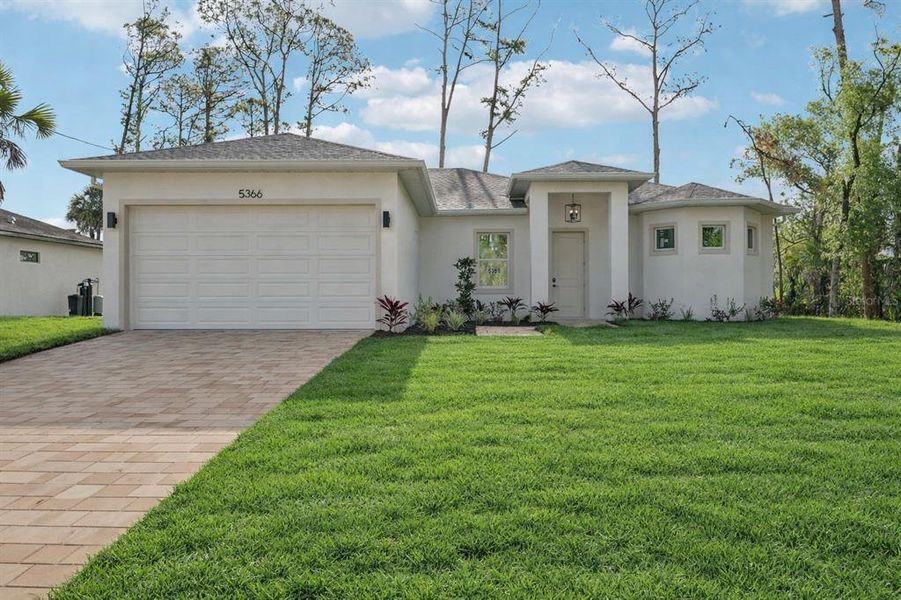 Front exterior of a new home in , North Port, FL, highlighting curb appeal (Image 22).