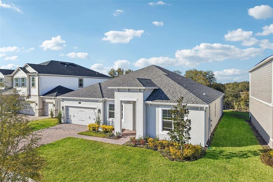 Front exterior of a new home in , Apopka, FL, highlighting curb appeal (Image 25).