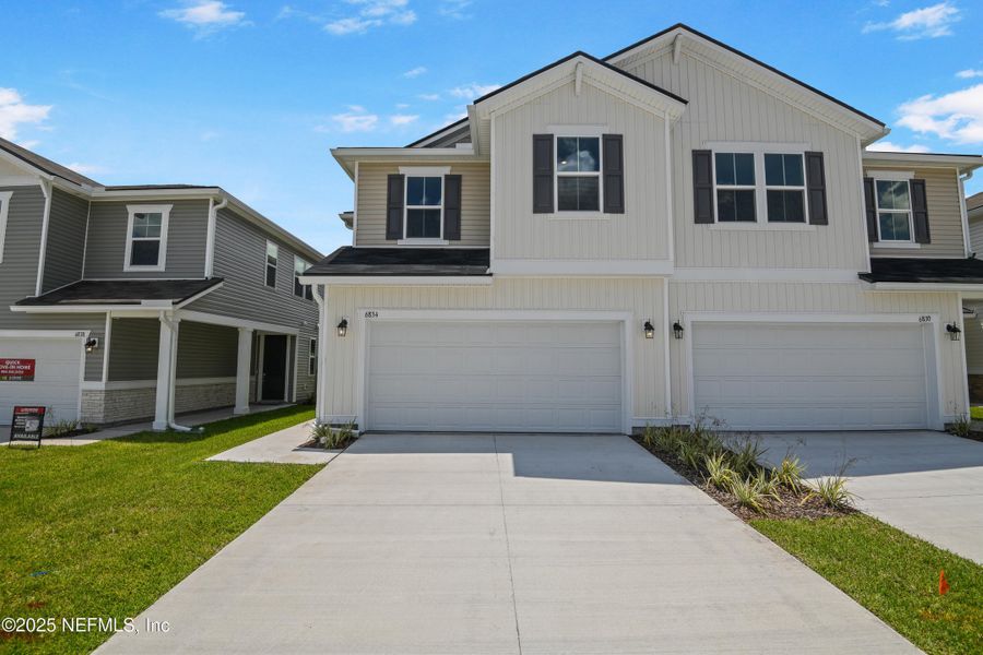 Front exterior of a new home in , Jacksonville, FL, highlighting curb appeal (Image 15).