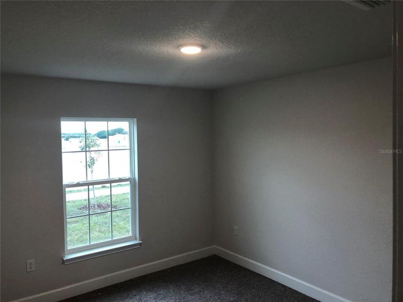 Spacious, unfurnished interior of a new home in Orange Blossom Hills, Summerfield (Image 17).