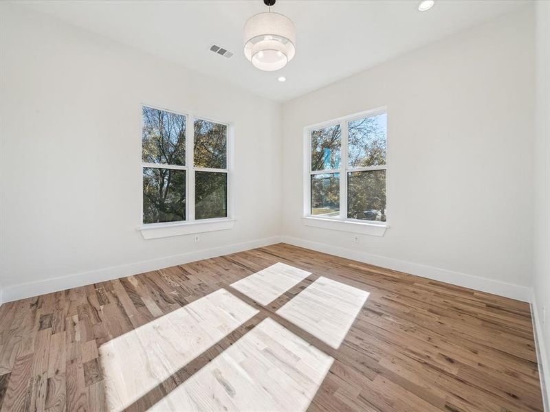 Spare room featuring hardwood / wood-style floors