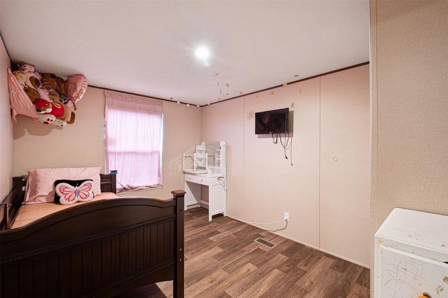 Bedroom featuring wood finished floors