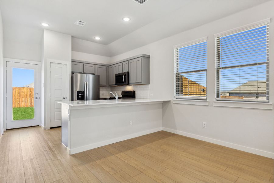 Kitchen in the Ash home plan by Trophy Signature Homes – REPRESENTATIVE PHOTO