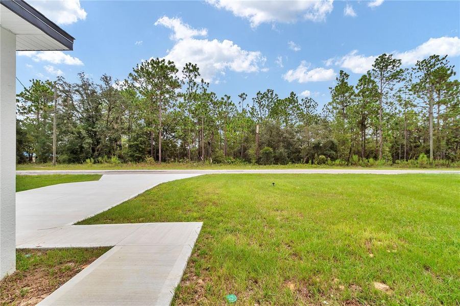 Front exterior of a new home in , Citrus Springs, FL, highlighting curb appeal (Image 21). Front exterior of a new home in , Citrus Springs, FL, highlighting curb appeal (Image 21).
