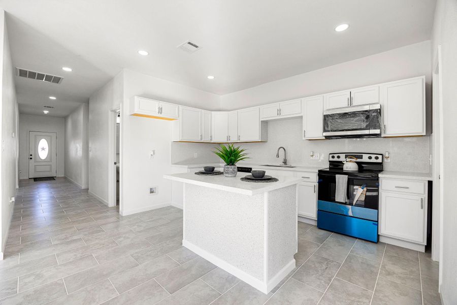 Experience the elegance of a modern kitchen with sleek white cabinetry, stainless steel appliances, and a spacious island perfect for entertaining. Experience the elegance of a modern kitchen with sleek white cabinetry, stainless steel appliances, and a spacious island perfect for entertaining.