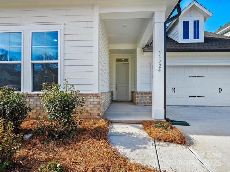 Exterior details and patio area of a home in North Creek Village, Huntersville (Image 4).