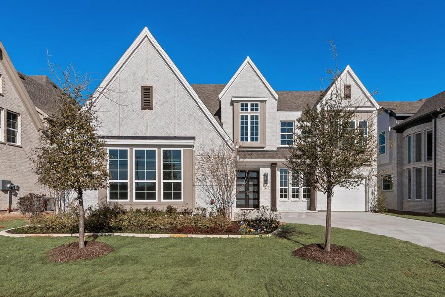 Front exterior of a new home in Grand Estates of Anna, Anna, TX, highlighting curb appeal (Image 1). Front exterior of a new home in Grand Estates of Anna, Anna, TX, highlighting curb appeal (Image 1).