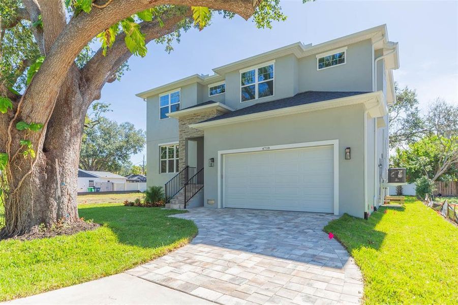 Front exterior of a new home in , Tampa, FL, highlighting curb appeal (Image 1). Front exterior of a new home in , Tampa, FL, highlighting curb appeal (Image 1).