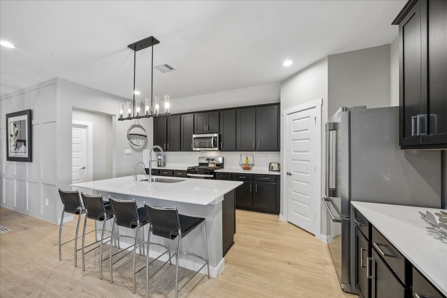 The door to the left through the kitchen leads to a coat closet and then the utility room.