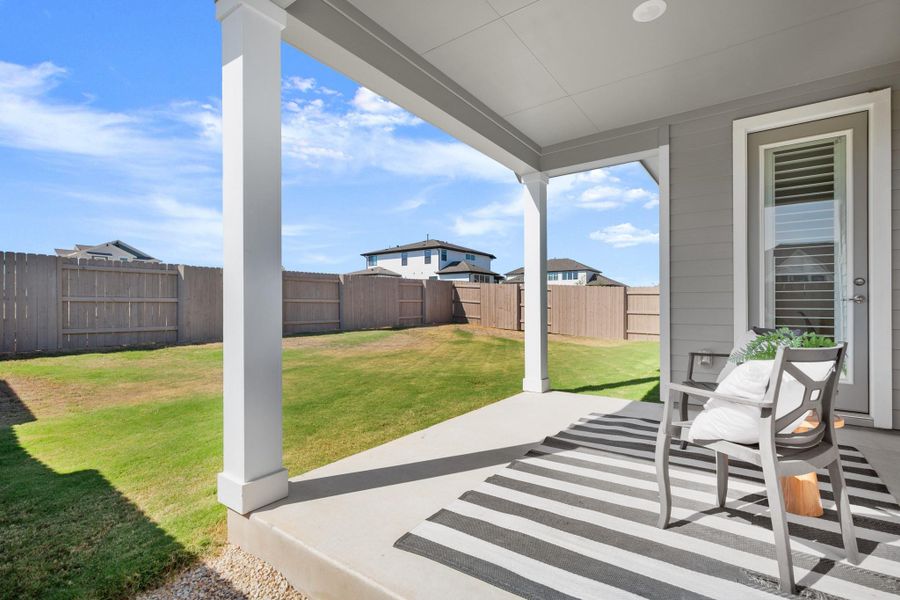 Fenced and private backyard featuring a patio
