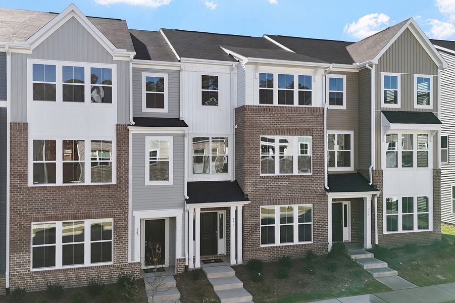 Front exterior of a new home in Renaissance at White Oak, Garner, NC, highlighting curb appeal (Image 2).