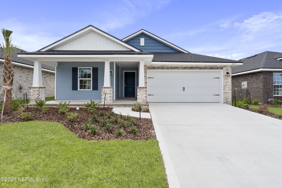 Front exterior of a new home in Shadow Crest at Rolling Hills, Green Cove Springs, FL, highlighting curb appeal (Image 16). Front exterior of a new home in Shadow Crest at Rolling Hills, Green Cove Springs, FL, highlighting curb appeal (Image 16).