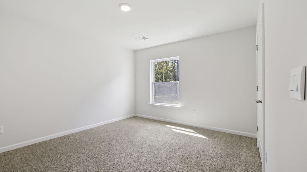 Spacious, unfurnished interior of a new home in Bentley Park, Greenwood (Image 16).